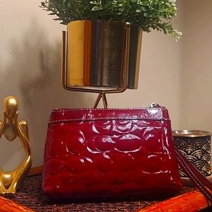 Coach, Burgundy patent leather wristlet.